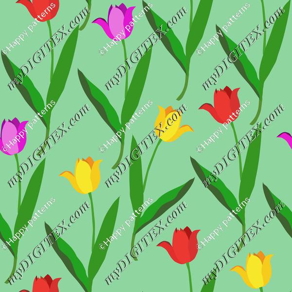 Colorful tulips on green